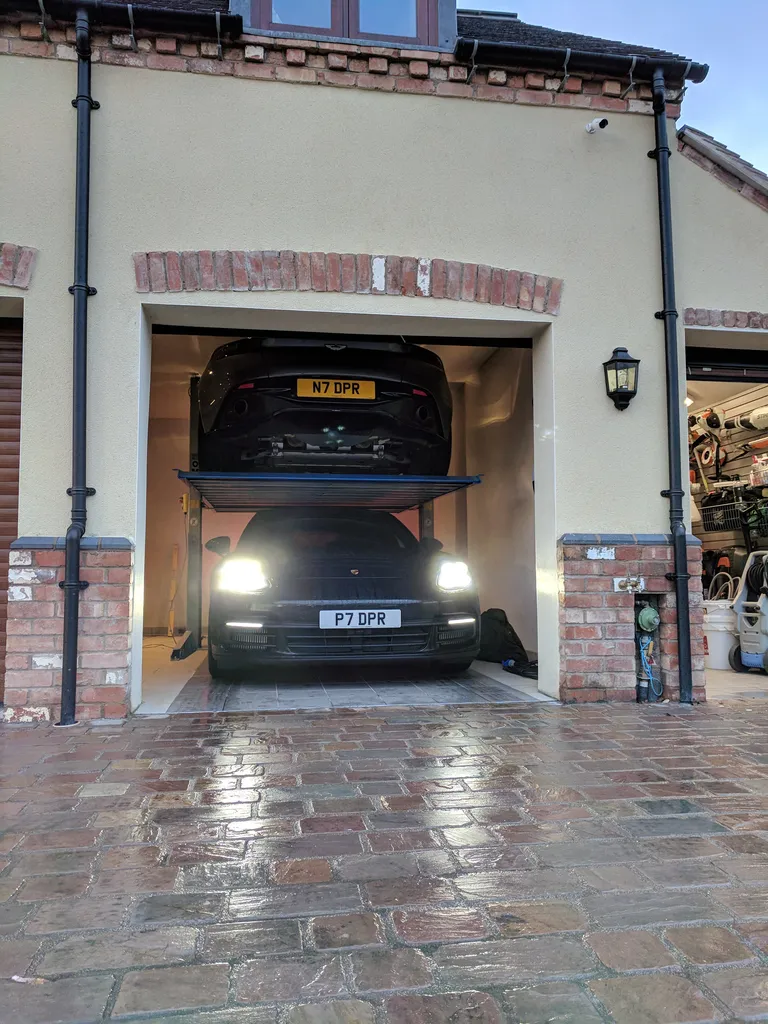 Strongman Lifts - Tongland low profile car stacking lift installed luxury garage