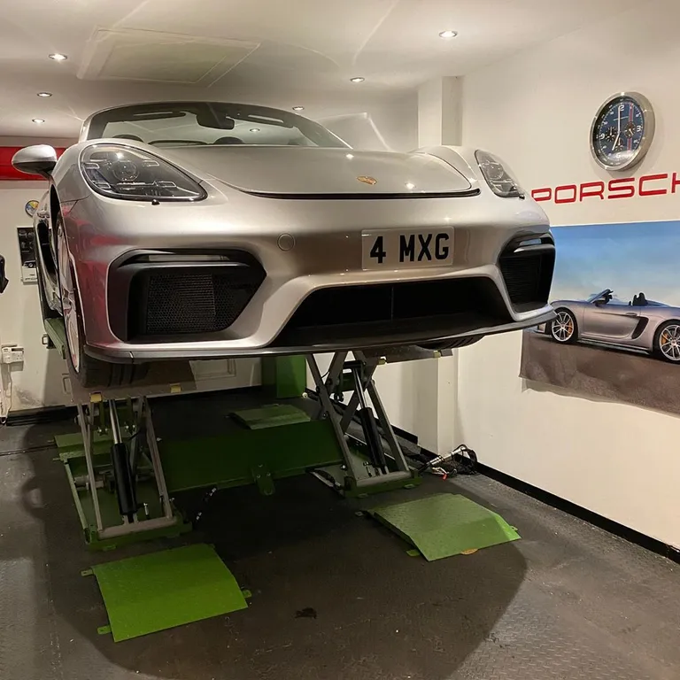 Strongman Lifts - Clifton midrise scissor car lift perfectly fitting in a small garage