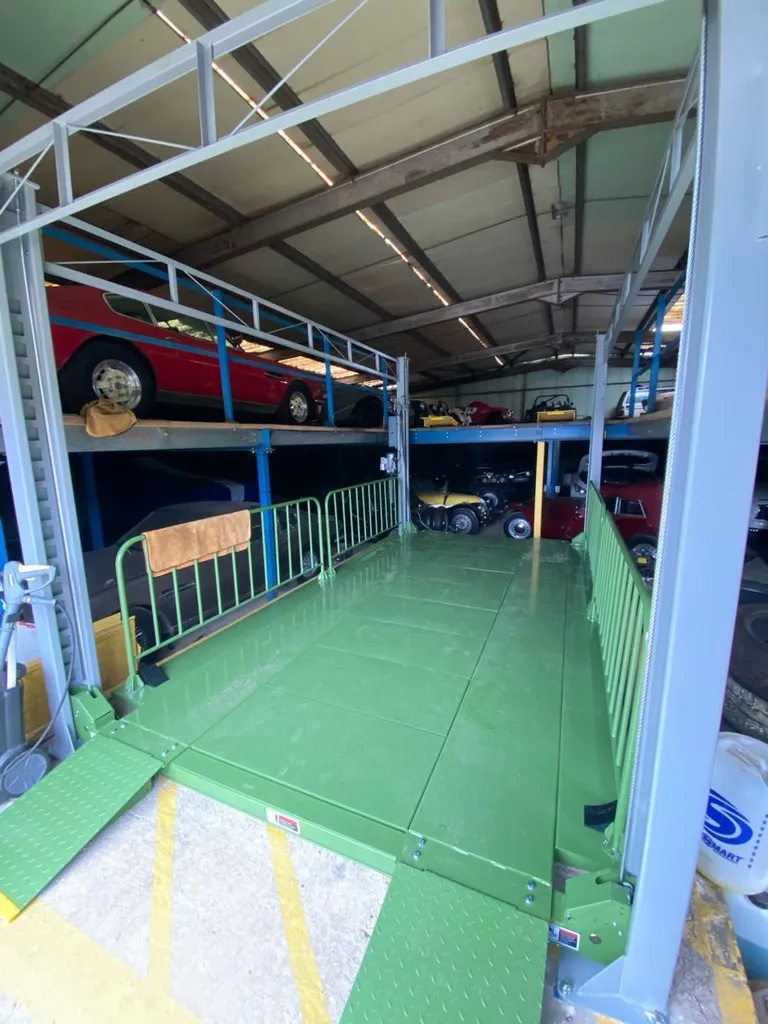 Strongman Lifts - Bannockburn four post mezzanine lift installed in a car storage facility