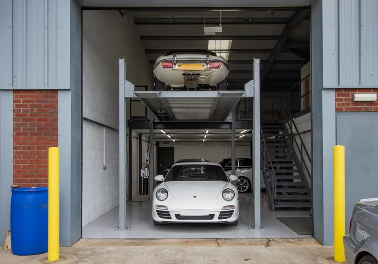 Strongman Lifts - Bannockburn tall four post car lift, lifting to same level as mezzanine floor