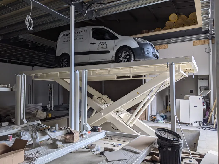 Strongman Lifts - Big scissor lift installs