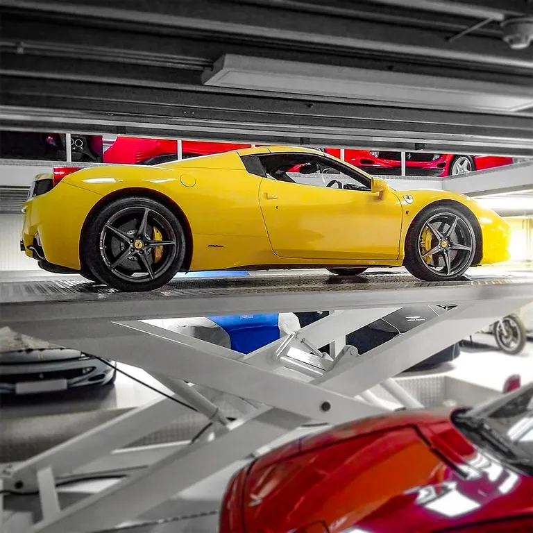 Strongman Lifts - Conwy multi-level scissor lift installed in a car storage facility