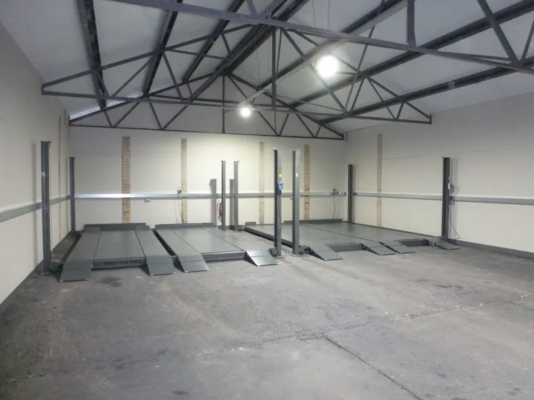 Strongman Lifts - Forth car parking lift installed in a car storage facility