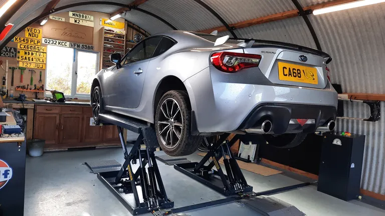 Strongman Lifts - Helmsdale scissor midrise car lift in customer's garage